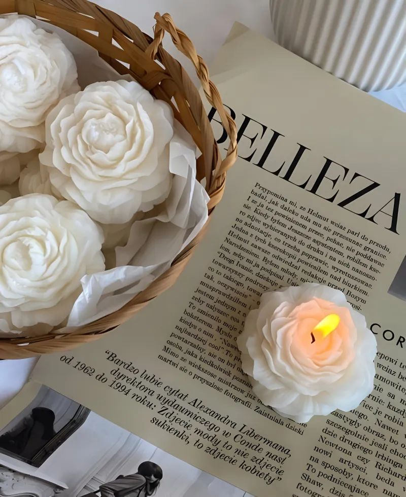 Hand-poured flower candles styled on a magazine flat-lay